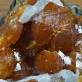 Mimetite var campylite in barrel-shaped crystals to 1 cm with baryte. Drygill, Caldbeck Fells.