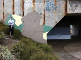 During: Painting out graffiti with camouflage