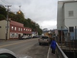 Ketchikan, Alaska. New Town,  with ship in distance. Four cruise ships were in port at the same time.  (John iPhone)