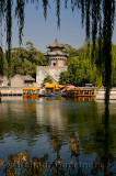Dragon boat ferries docked at the Gate Tower of Cloud Retaining Eaves on Kunming Lake at Summer Palace Beijing