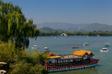 South Lake Island Dragon boat ferry with Jade Peak Pagoda and Jade Belt Bridge at Summer Palace Beijing
