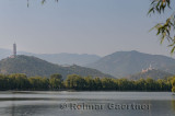 Jade Peak Pagoda on Jade Spring Mountain and Swimmer in West Kunming Lake Summer Palace Beijing