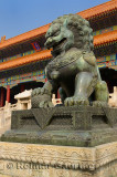 Bronze male lion symbol of power at the Gate of Supreme Harmony in the Forbidden City Beijing China