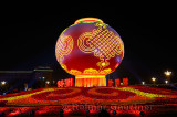 Globe and flower decorations at night National Day celebrations in Tiananmen Square with Great Hall of the People Beijing