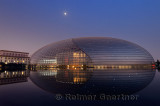 National Centre for the Performing Arts egg at dusk with moon and Great Hall of the People in Beijing