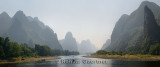Panorama of the Lijiang River surrounded by tall limestone peak Karst formations