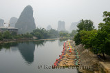 Row of bamboo raft tour boats at Yangshuo on the Yulong river China
