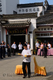 Outdoor race for restaurant wait staff carrying plates with ping pong balls in Huangshan China