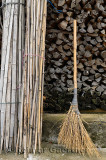 Broom poles and firewood in the street of Shangshe on Fengle lake Huangshan China