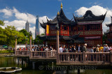 Crowds of tourists on the nine Zigzag bridge at the famous Huxinting Teahouse midlake pavilion Shanghai China