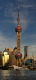 Sunset glow on Oriental Pearl Radio & TV Tower on Pudong east side of Shanghai China