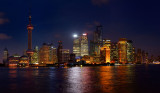 Twilight and night lights of Pudong east side high rise towers of Shanghai China