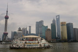 Boat cruise on the Huangpu river with Pudong high rise towers in the morning Shanghai China
