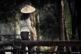 Ethnic Cultural Park.The Chinese Woman on the Bridge