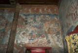 the third picture on the left side of the buddha