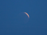 21:14 - The small part of the partially lit moon is now clearly visible