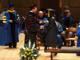 Second handshake and handing of diploma