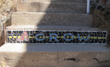 mosaic in stairs up to High Road from Iron Man intersection