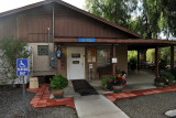 THE ENTRANCE TO THE OFFICE AND THE RANCH HOUSE KITCHEN AND LOUNGE TO THE RIGHT