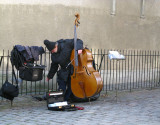 Montmartre - Contrabasso Player is Feeding Pigeons During Break