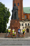 Group of cyclist near the monument of Boleslaw Chrobry