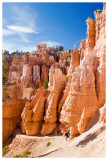 Hikers wind their way among the hoodoos