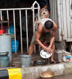 street vendor cleaning dishes