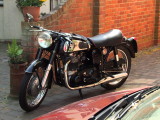 A  Norton  Dominator  500cc  outside  a  cafe.