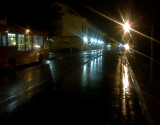 Nightlights  reflected  on  wet  roads.