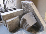 pieces of the stonework are stacked in front and behind