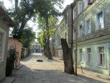beyond the often elegant facades, the buildings behind are usually more humble