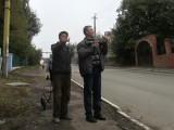 a passer-by points out some special features to Vitaly