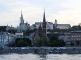 the sun is setting over the Buda hill...