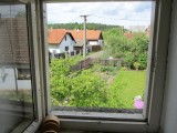 a view out an attic window toward the front