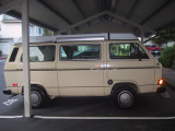 side view of van - CB radio antenna mounted up front above glowing turn signal