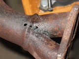 saw in at end of black V on either side
