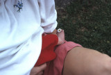 09 Dylans foot and Torys knee, with flower.jpg