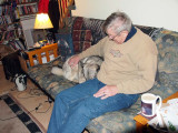 Sneaky! Doggie joins Ron on the sofa.