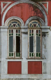 Twins under a arch with tones of red-pink