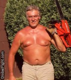 man chain sawing trees.jpg