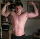 biceps younger jock flexing.jpg