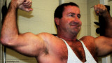 huge bearish daddy man double biceps pose flexing.jpg