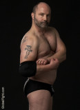 tattooed husky wrestler beefcake large tall man.jpg