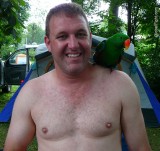 man with parrot bird on shoulder gay campground.jpg