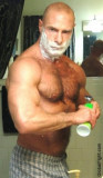 bald hairy man shaving bathroom.jpg