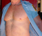 fireman taking off shirt husky hunk.jpg