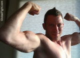 biceps dude flexing peaks.jpg