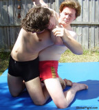 redhead boys backyard rough housing wrestling.jpg