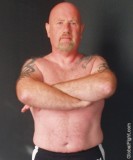 bald tattoed biker man tattoos fighter grappler.jpg