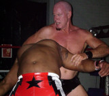 white wrestling man dominating beating black opponent.jpg